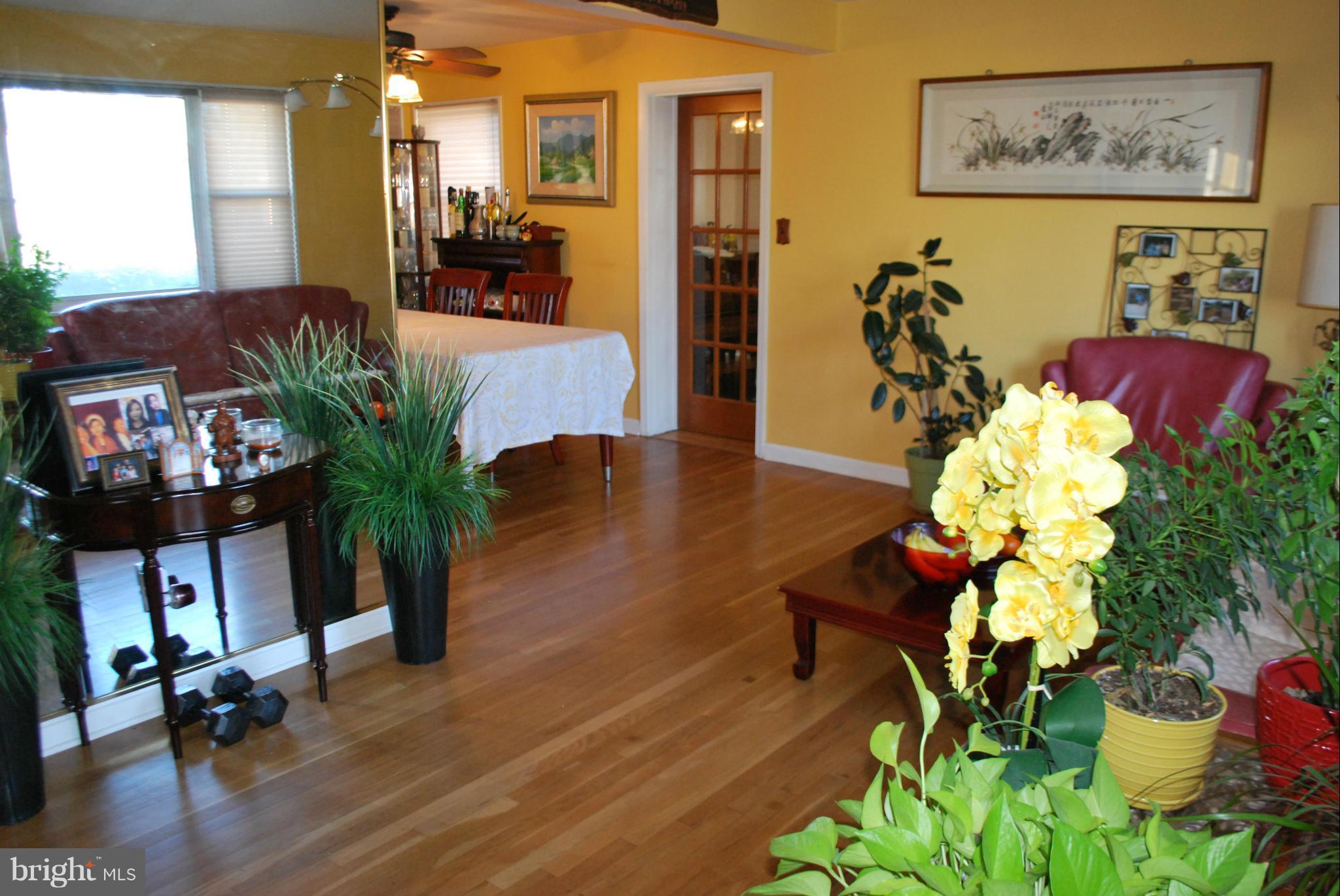 6833 Inverness Drive Springfield, VA 22150 - Photo 7 of 30 a living room with furniture flowers and flowers