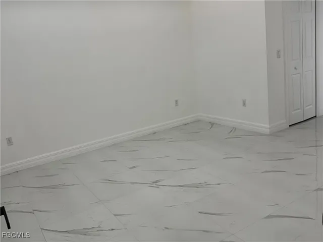 a bathroom with a sink a toilet a shower and a mirror