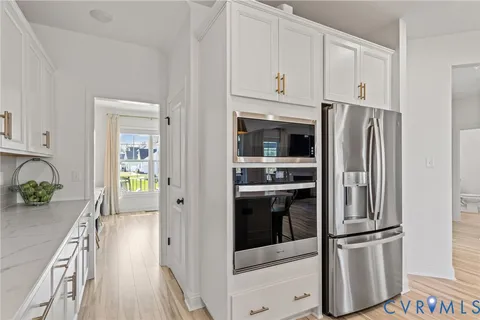 a kitchen with stainless steel appliances a refrigerator sink and stove
