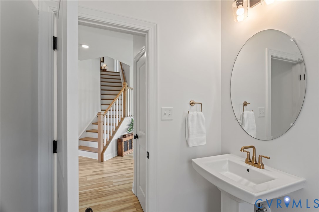 4700 Melbrook Way Moseley, VA 23120 - Photo 24 of 58 a bathroom with a sink and a mirror