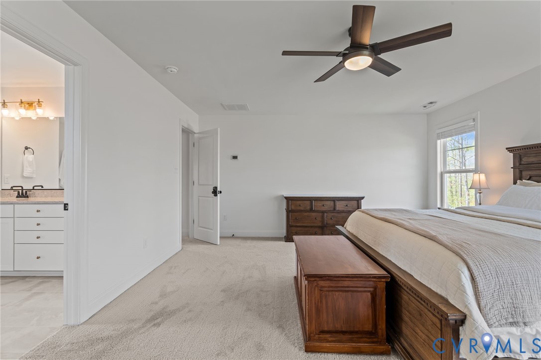 4700 Melbrook Way Moseley, VA 23120 - Photo 29 of 58 a bedroom with a bed and a dresser