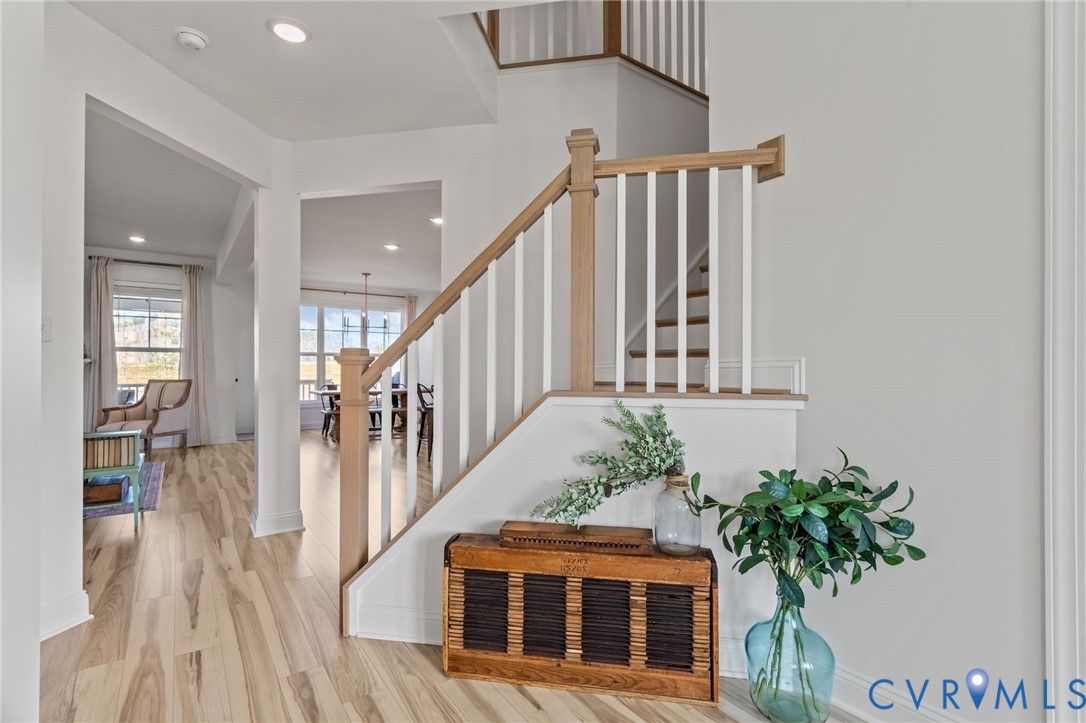 4700 Melbrook Way Moseley, VA 23120 - Photo 3 of 58 a view of staircase with wooden floor and a potted plant