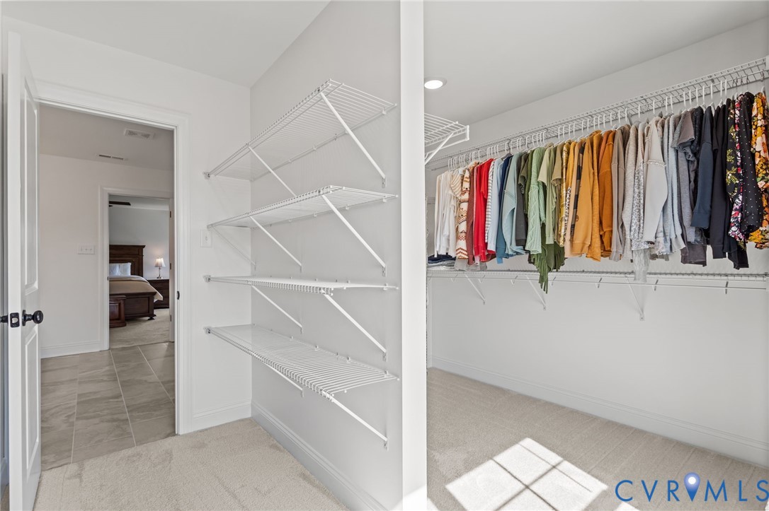 4700 Melbrook Way Moseley, VA 23120 - Photo 33 of 58 a view of walk in closet with clothes