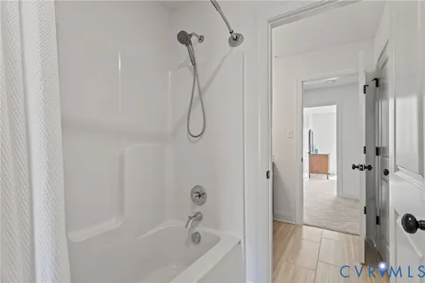 a view of room with workspace and windows