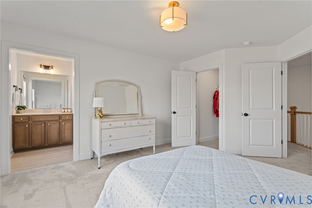 4700 Melbrook Way Moseley, VA 23120 - Photo 36 of 58 a bedroom with a bed and a dresser