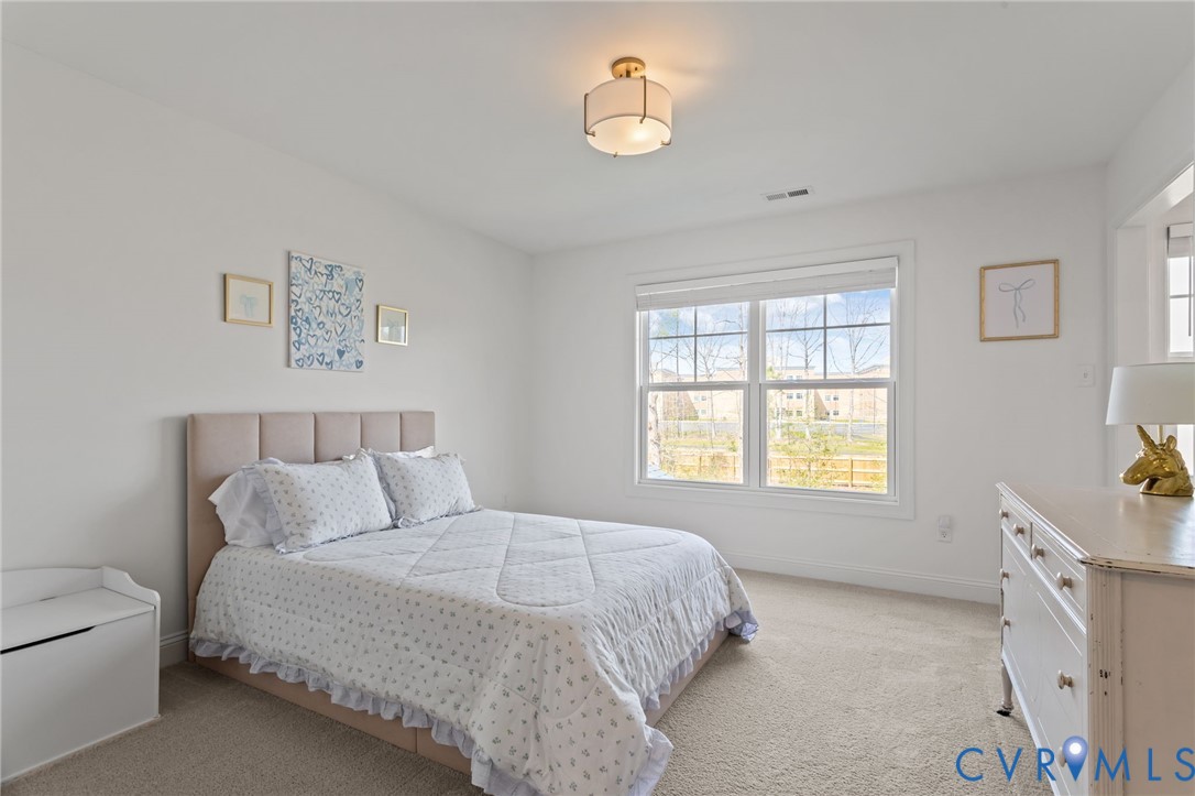 4700 Melbrook Way Moseley, VA 23120 - Photo 37 of 58 a bedroom with a bed and a window