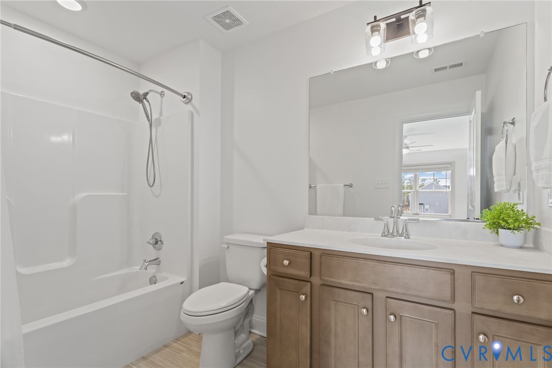 4700 Melbrook Way Moseley, VA 23120 - Photo 42 of 58 a bathroom with a sink a toilet and shower