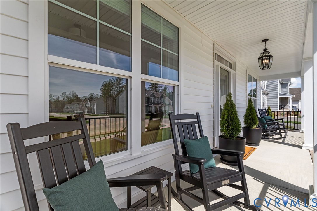 4700 Melbrook Way Moseley, VA 23120 - Photo 51 of 58 a view of a dining room with furniture window and wooden floor