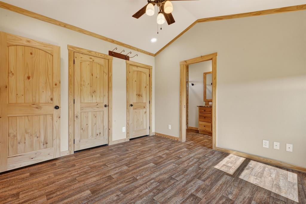 2401 Lamkin Road Mineral Wells, TX 76067 - Photo 17 of 36 a view of a livingroom with wooden floor