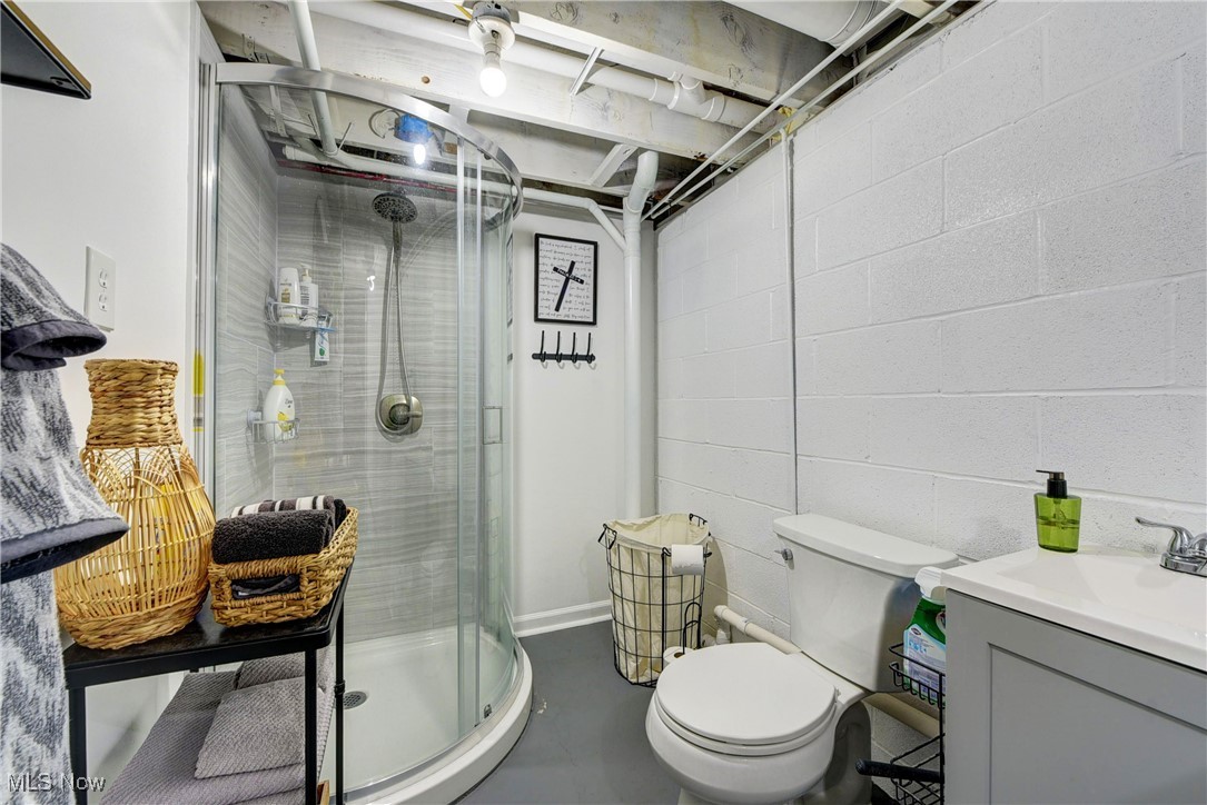 3615 Kolbe Road Lorain, OH 44053 - Photo 24 of 33 Bathroom with toilet, walk in shower, and vanity