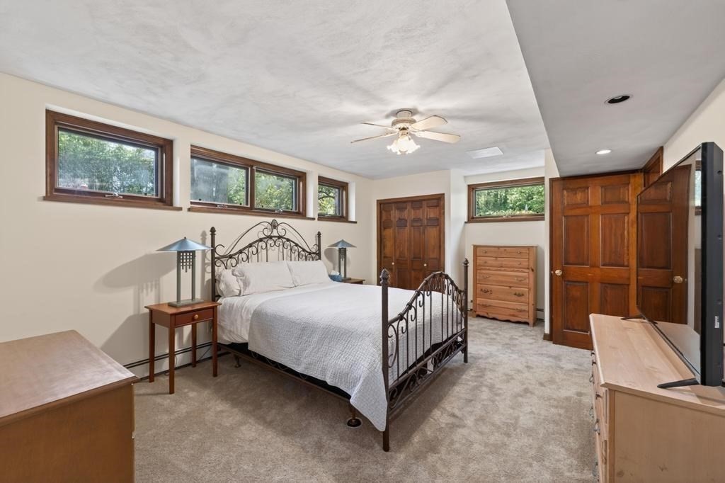 38 Gaudette Street Fall River, MA 02721 - Photo 39 of 41 a bedroom with a bed a table and chair