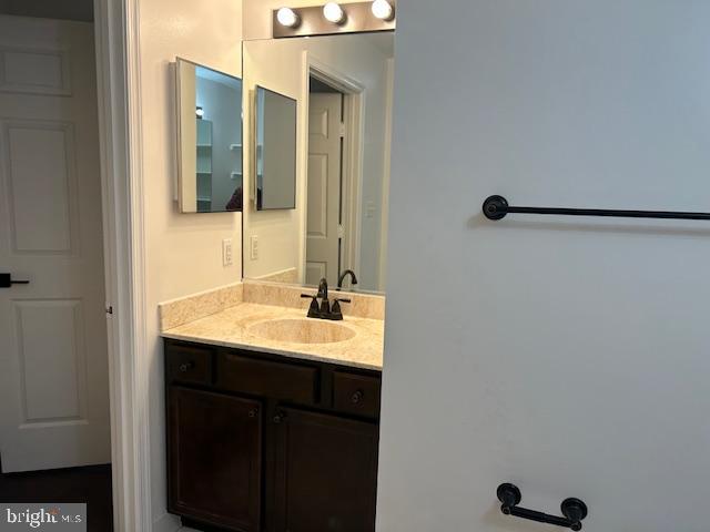 104 Kendrick Place, Unit 18 Gaithersburg, MD 20878 - Photo 14 of 18 a bathroom with a double vanity sink and a mirror