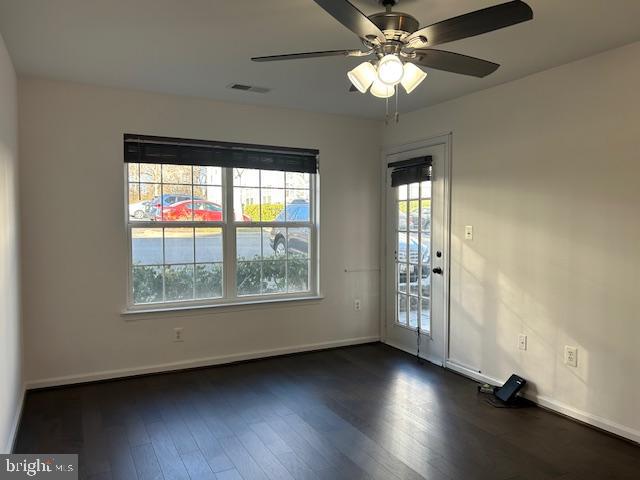 104 Kendrick Place, Unit 18 Gaithersburg, MD 20878 - Photo 9 of 18 an empty room with wooden floor chandelier fan and windows