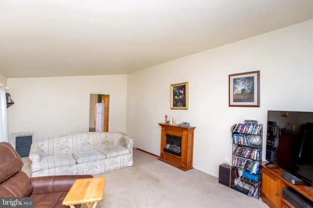 a bedroom with furniture and a flat screen tv