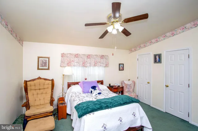 a bed room with a bed and a chandelier