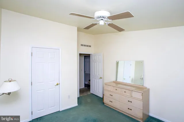 a view of room closet and wooden floor