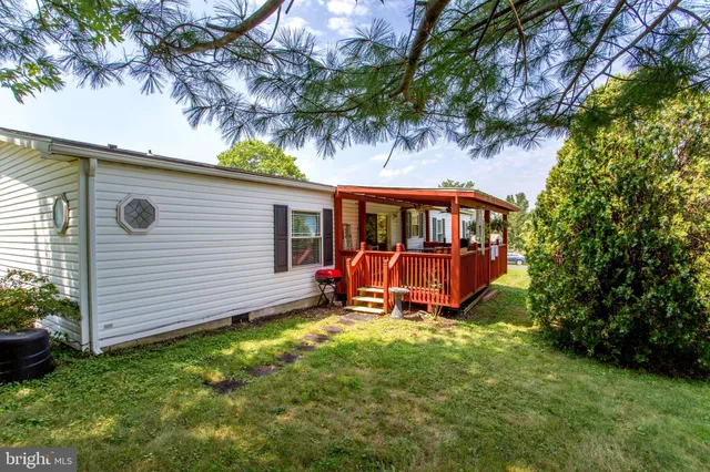 a view of a backyard with a sitting area