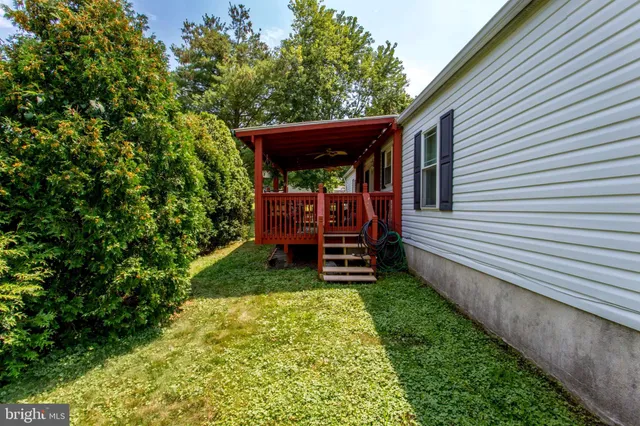 a view of a small yard with wooden fence