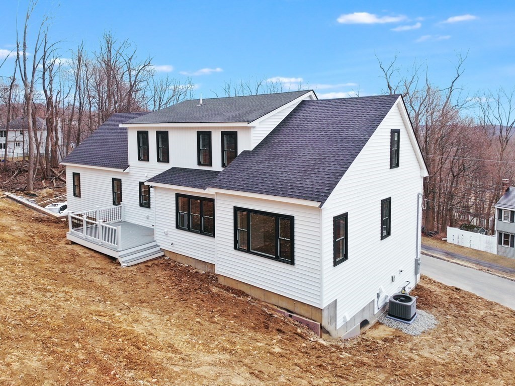 36 Belvidere Road Haverhill, MA 01830 - Photo 3 of 18 a view of a white house with a yard and sitting area