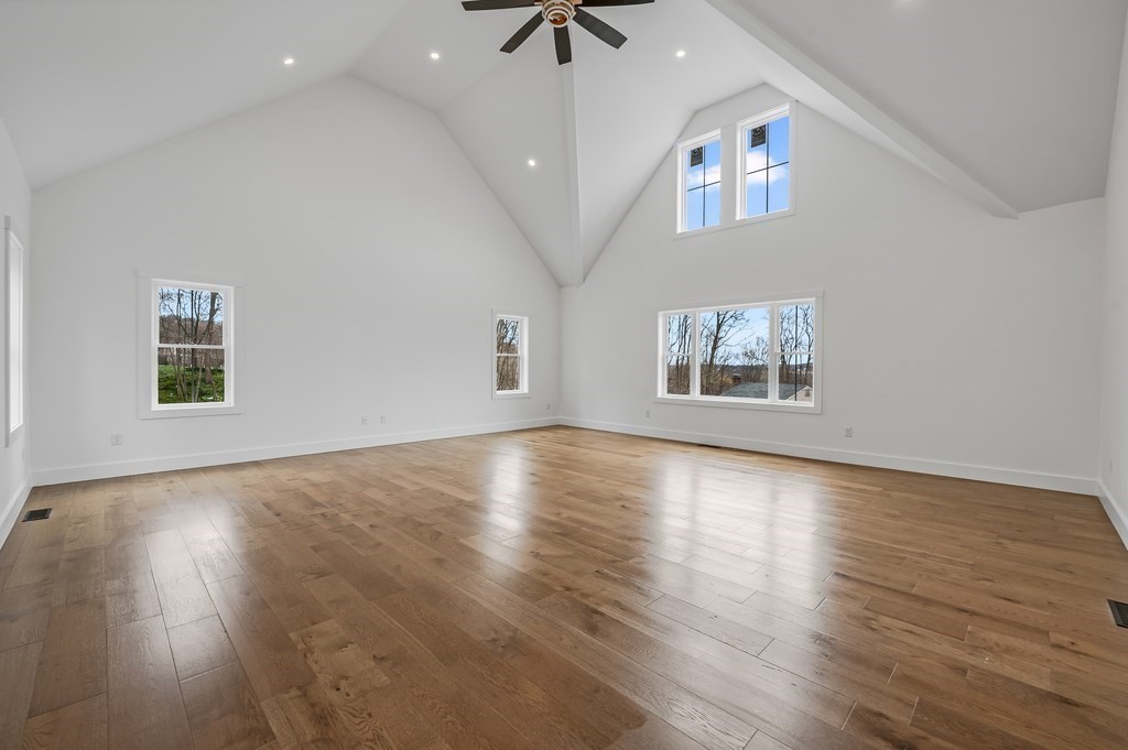 36 Belvidere Road Haverhill, MA 01830 - Photo 4 of 18 a view of an empty room with window and wooden floor