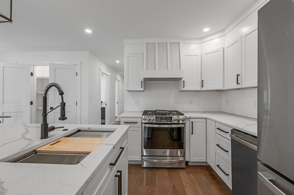 36 Belvidere Road Haverhill, MA 01830 - Photo 5 of 18 a kitchen with a stove sink and cabinets