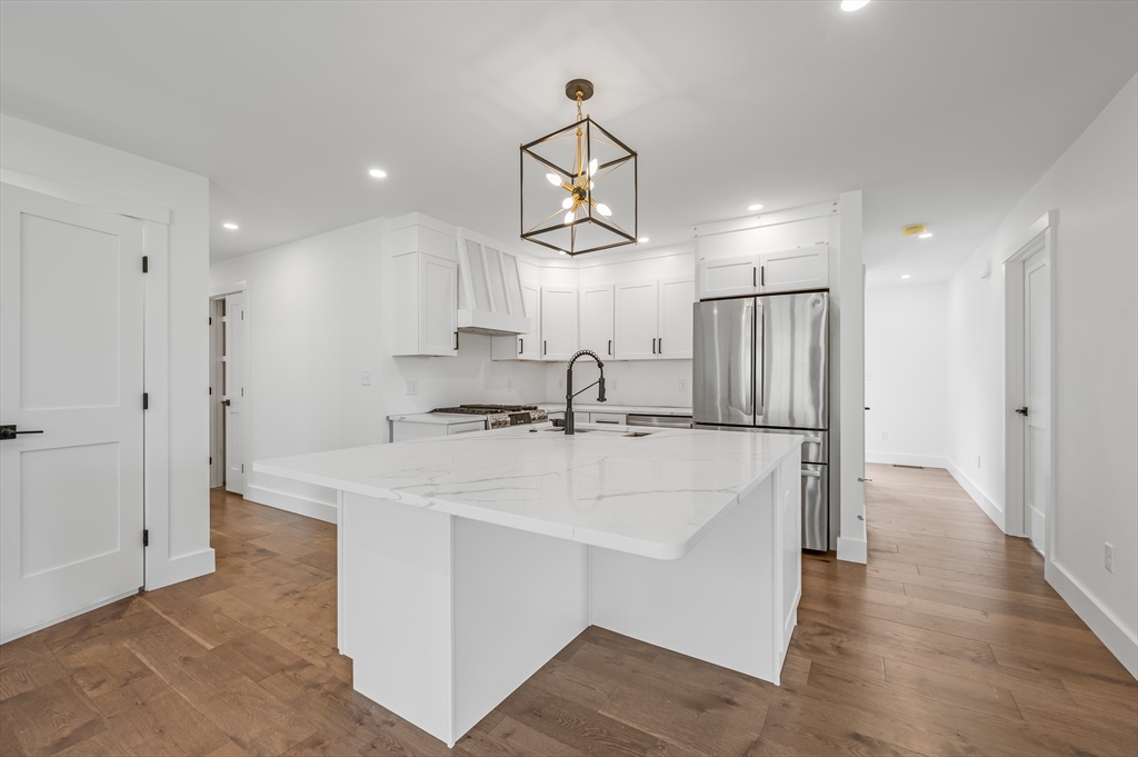 36 Belvidere Road Haverhill, MA 01830 - Photo 6 of 18 a view of a kitchen with a sink stainless steel appliances and cabinets
