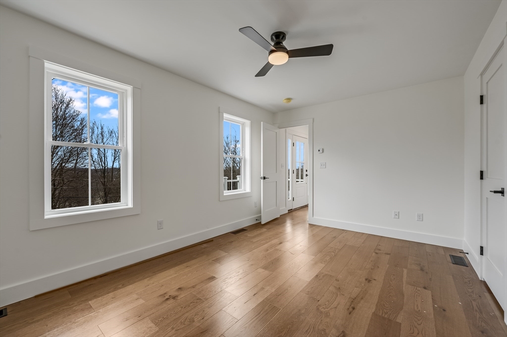 36 Belvidere Road Haverhill, MA 01830 - Photo 9 of 18 a view of empty room with wooden floor and fan