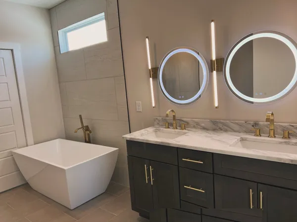 a bathroom with a toilet a sink and a mirror