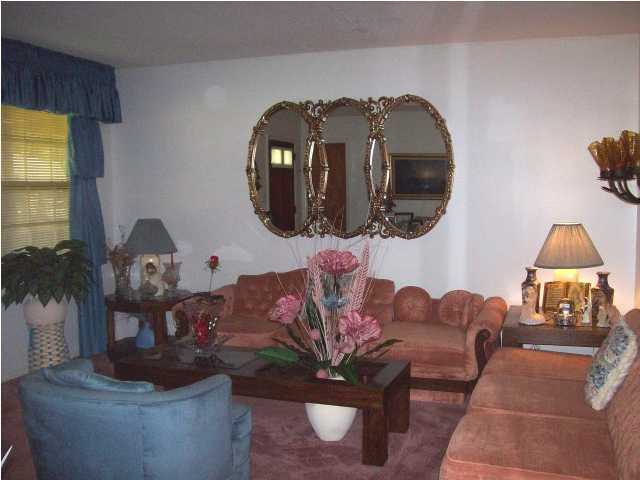 235 Deluna Road Southwest Fort Walton Beach, FL 32548 - Photo 2 of 24 a living room with furniture and a mirror