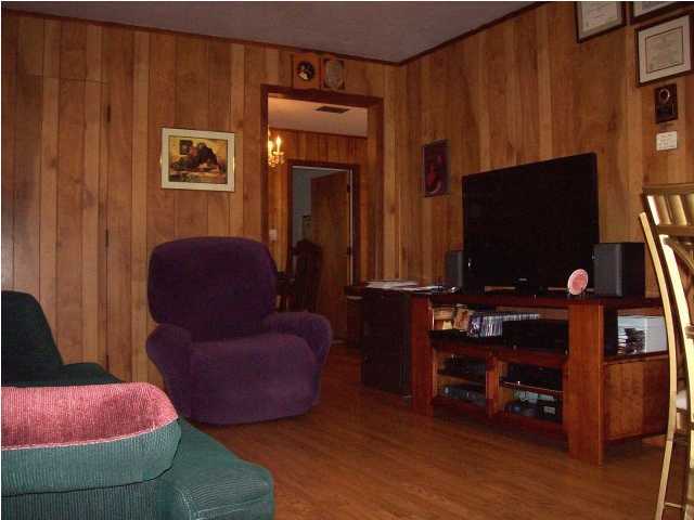 235 Deluna Road Southwest Fort Walton Beach, FL 32548 - Photo 11 of 24 a living room with furniture and a flat screen tv