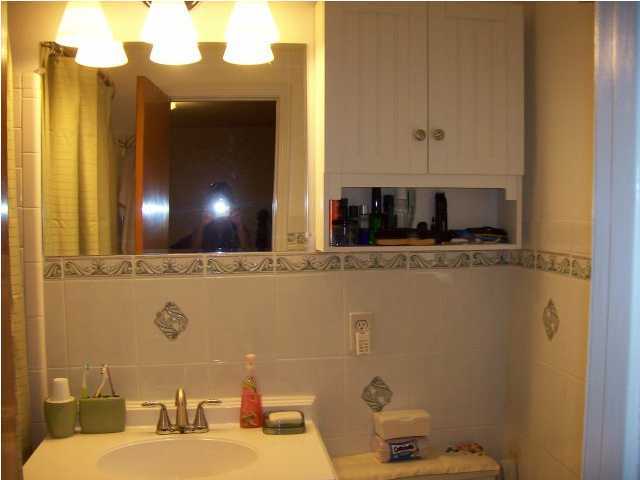 235 Deluna Road Southwest Fort Walton Beach, FL 32548 - Photo 17 of 24 a bathroom with a sink and a mirror