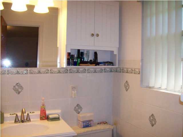 235 Deluna Road Southwest Fort Walton Beach, FL 32548 - Photo 18 of 24 a bathroom with a sink and a mirror