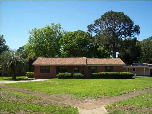 235 Deluna Road Southwest Fort Walton Beach, FL 32548 - Photo 23 of 24 a front view of a house with garden