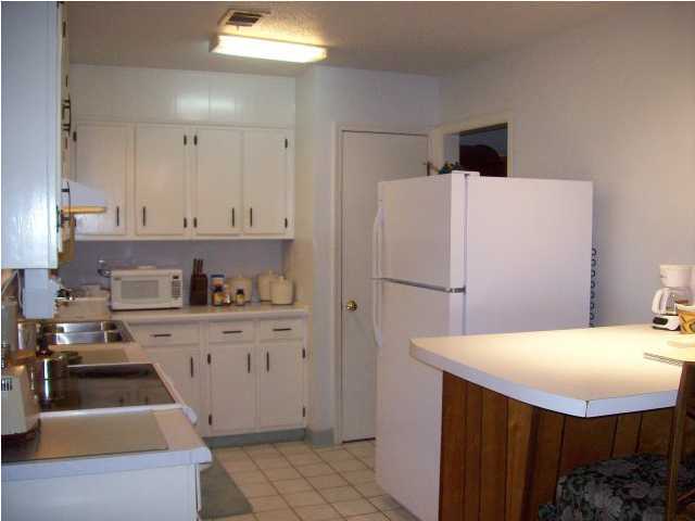 235 Deluna Road Southwest Fort Walton Beach, FL 32548 - Photo 7 of 24 a kitchen with a sink appliances and cabinets