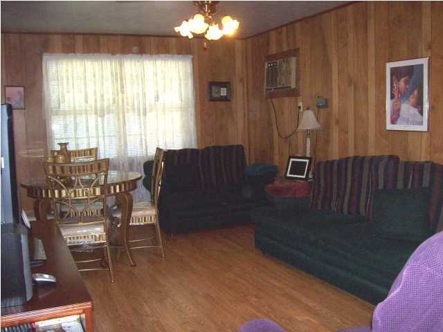 235 Deluna Road Southwest Fort Walton Beach, FL 32548 - Photo 10 of 24 a living room with furniture and a large window
