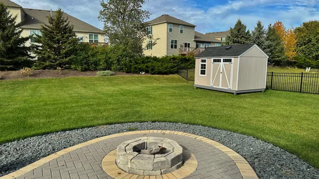 a swimming pool with outdoor seating and garden