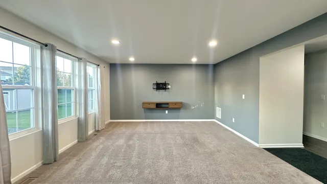 wooden floor in an empty room with a fireplace