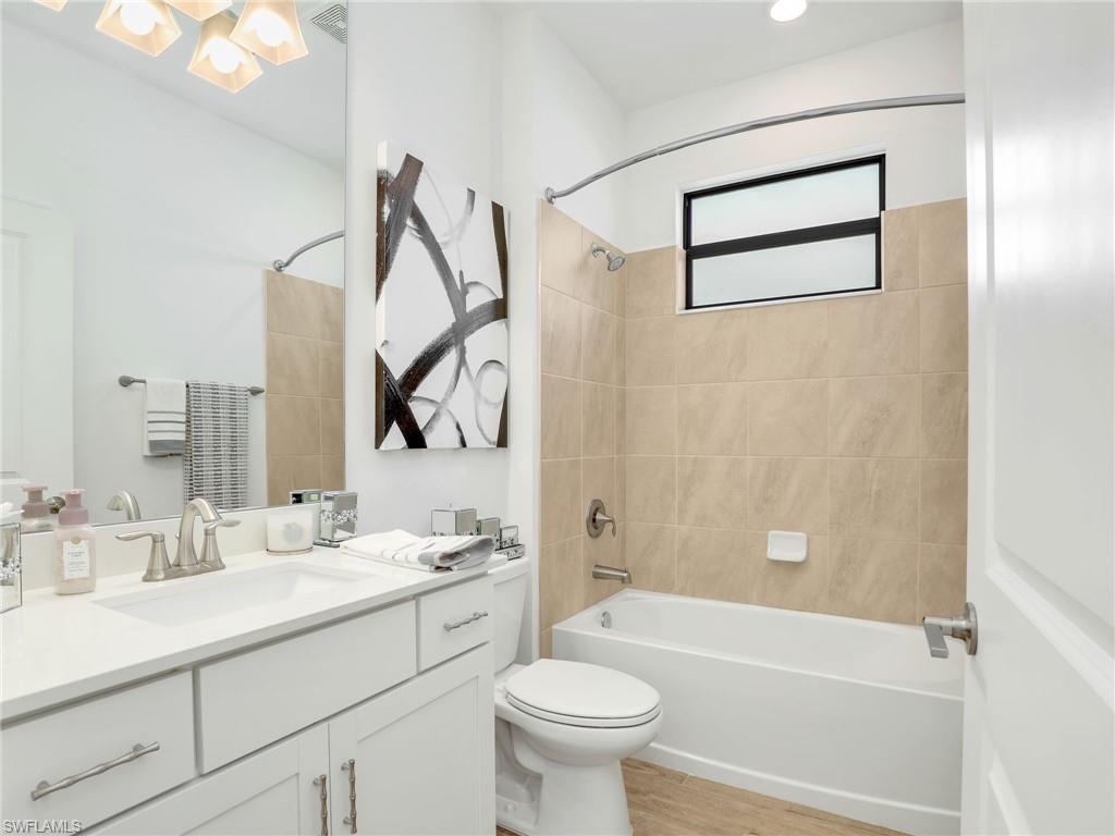 18278 Ridgeline Drive Estero, FL 33928 - Photo 25 of 45 a bathroom with a sink a toilet and a bathtub