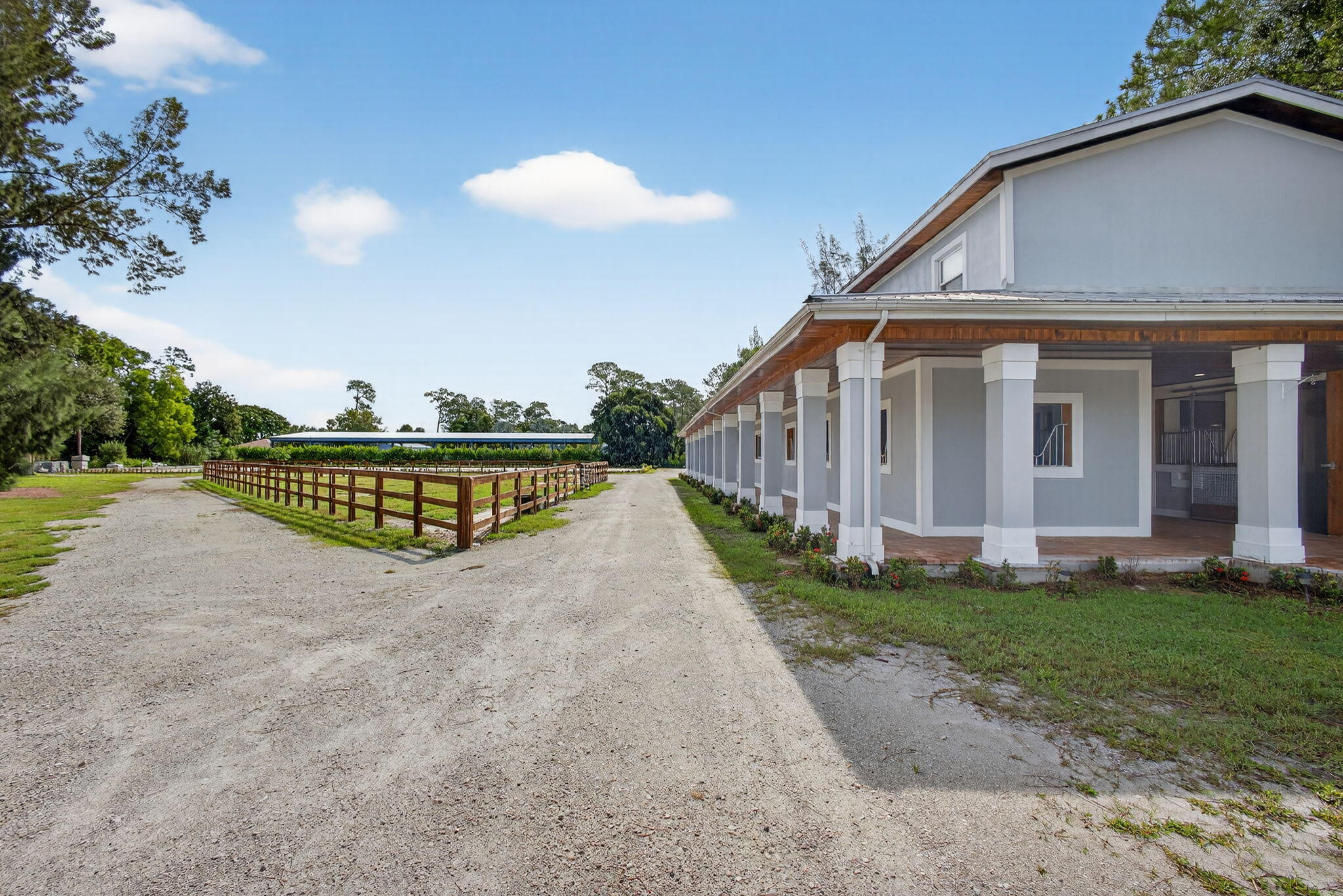 1032 Hyde Park Road Loxahatchee Groves, FL 33470 - Photo 15 of 30 a view of a house with a yard and a garden