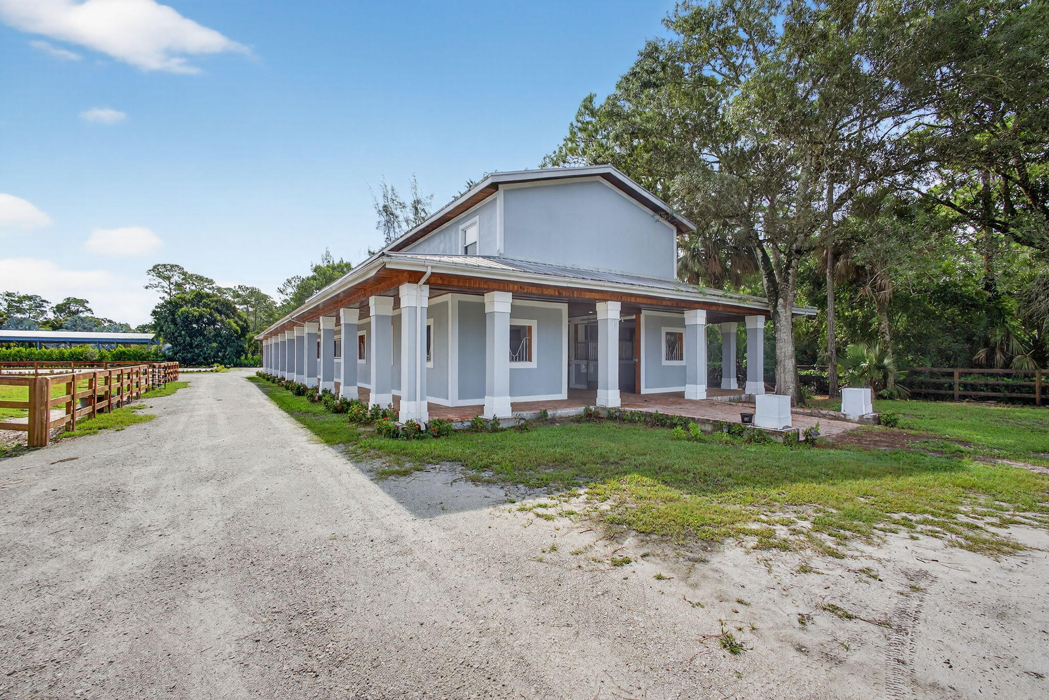 1032 Hyde Park Road Loxahatchee Groves, FL 33470 - Photo 16 of 30 a view of a house with a yard and sitting area