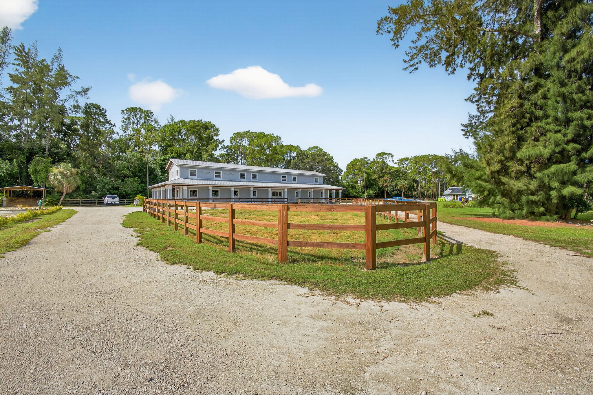 1032 Hyde Park Road Loxahatchee Groves, FL 33470 - Photo 20 of 30 a view of a park with large trees