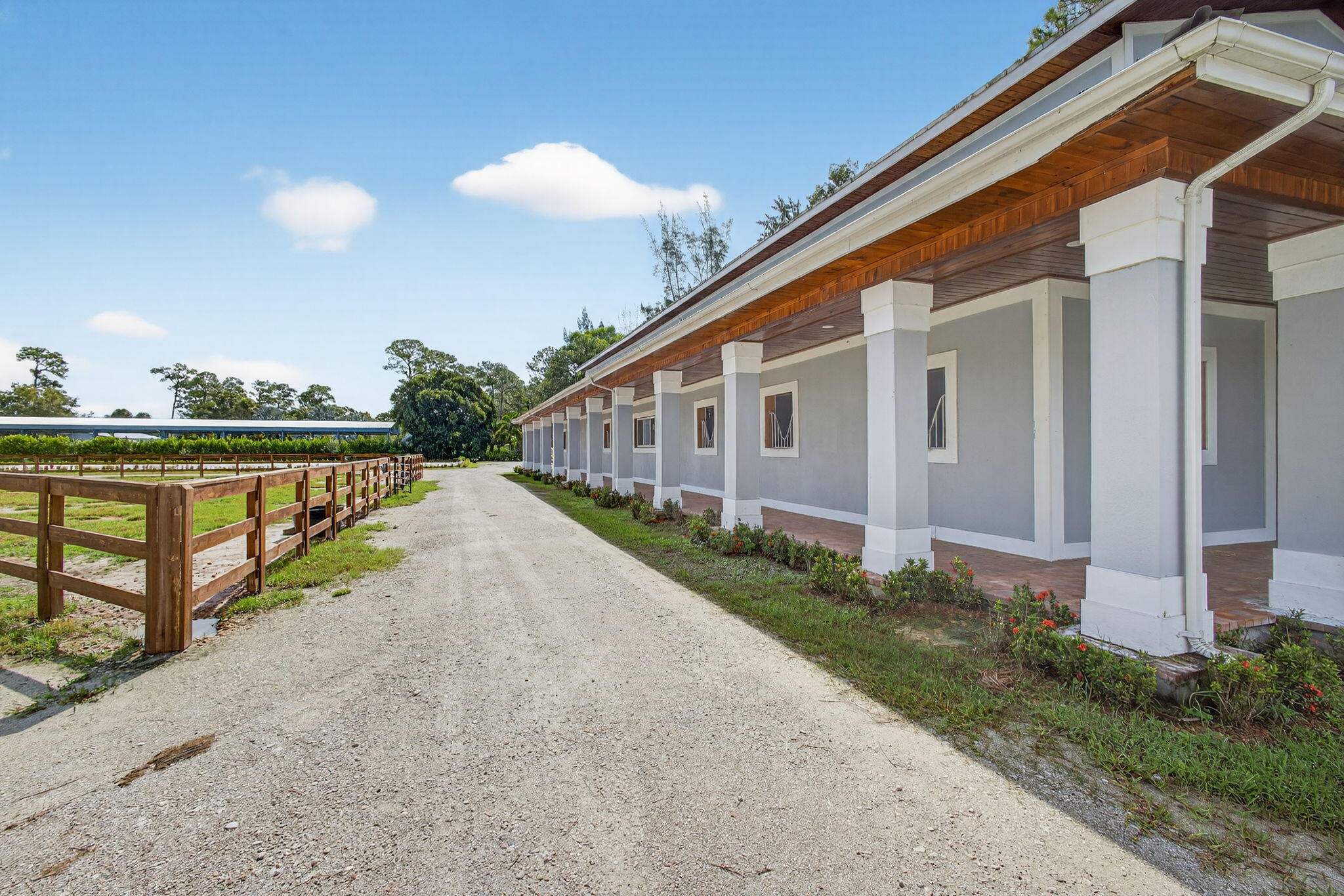 1032 Hyde Park Road Loxahatchee Groves, FL 33470 - Photo 22 of 30 a view of a house with backyard and balcony