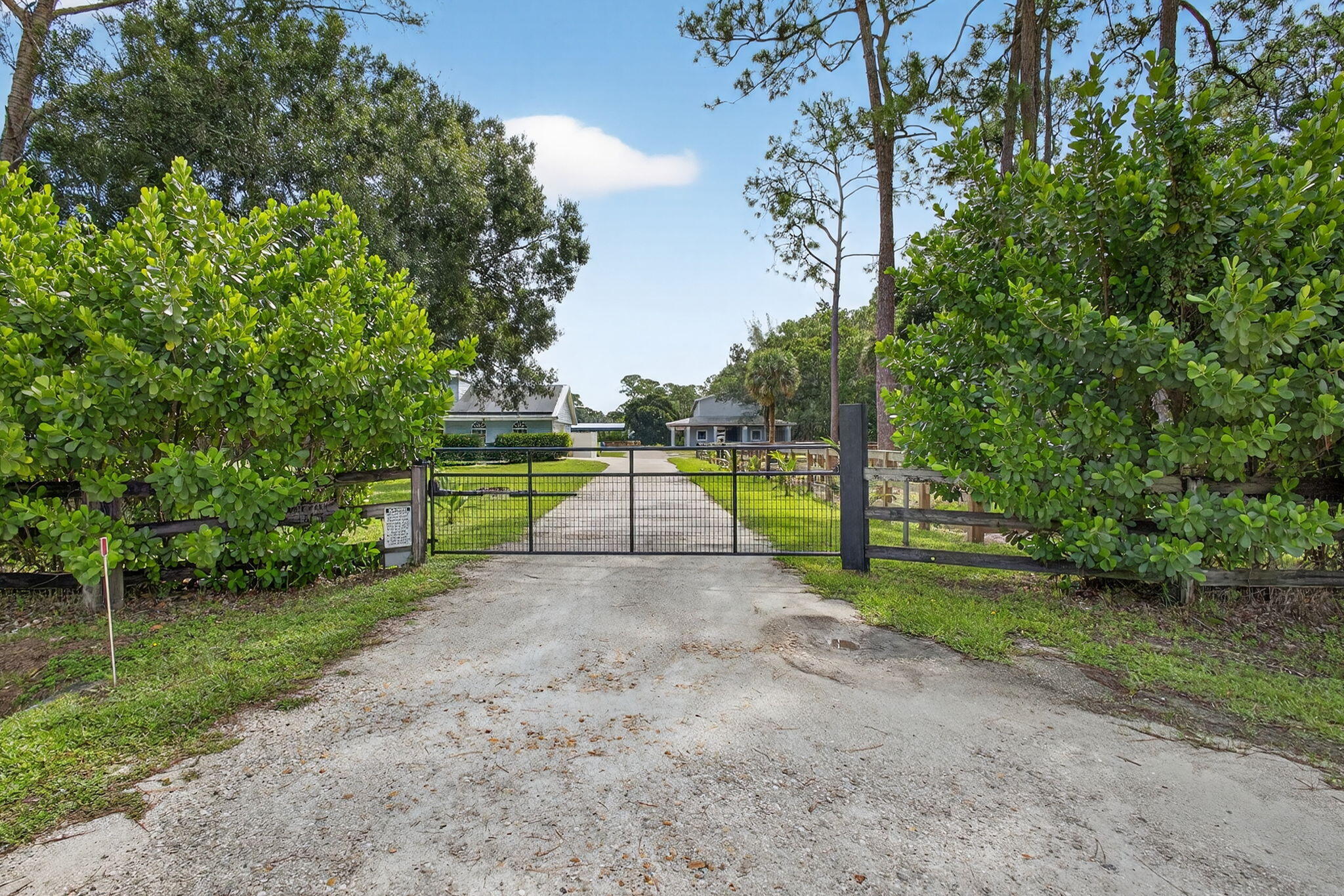 1032 Hyde Park Road Loxahatchee Groves, FL 33470 - Photo 29 of 30 a view of a park with large trees