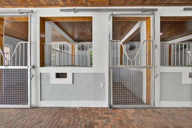 a view of a brick house with wooden floor and a large window