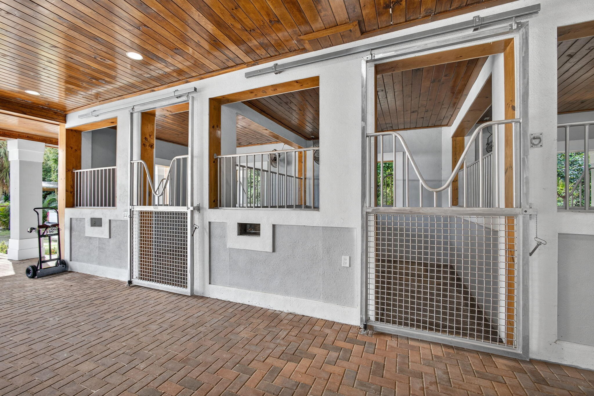 1032 Hyde Park Road Loxahatchee Groves, FL 33470 - Photo 10 of 30 a view of a brick house with wooden floor and a large window