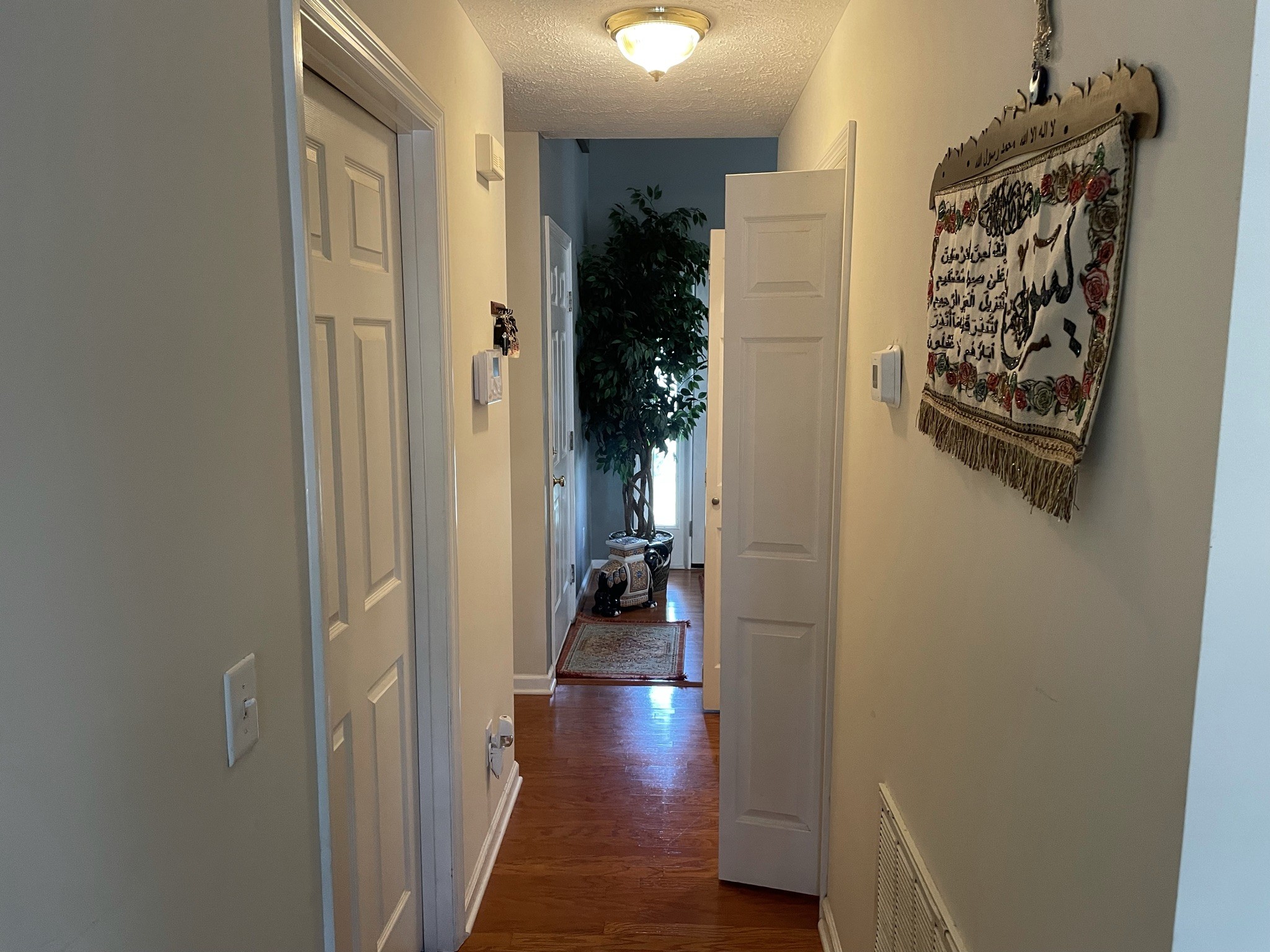 721 Canoe Ridge Point Antioch, TN 37013 - Photo 13 of 50 a view of a hallway with wooden floor and closet