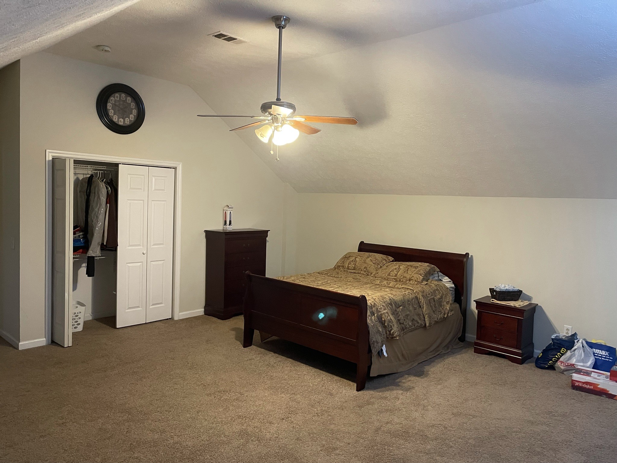 721 Canoe Ridge Point Antioch, TN 37013 - Photo 26 of 50 a spacious bedroom with a bed and a ceiling fan