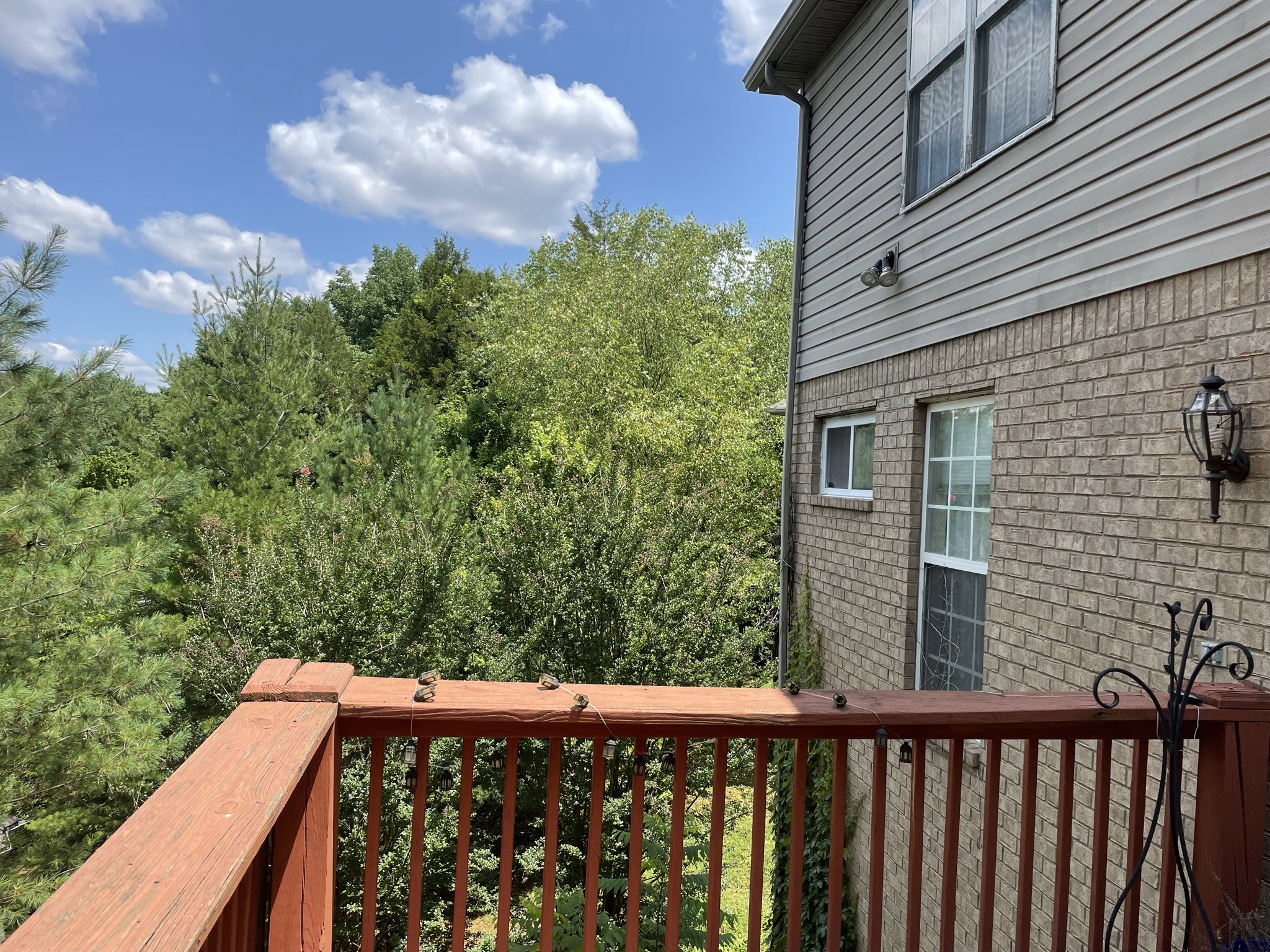 721 Canoe Ridge Point Antioch, TN 37013 - Photo 44 of 50 a view of a roof deck with wooden floor and fence