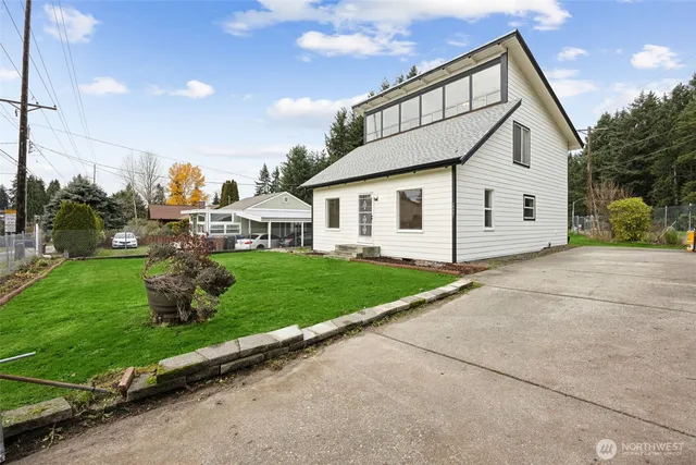 a front view of a house with garden
