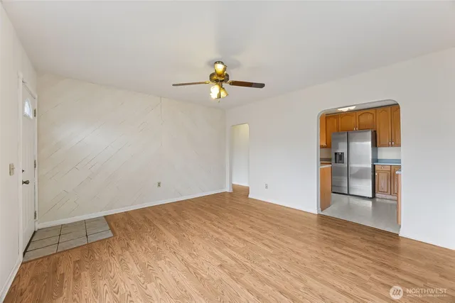 wooden floor in an empty room with a window